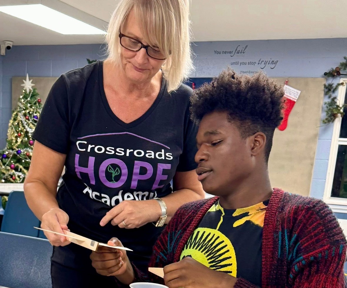 Crossroads Hope Academy mentor with a student